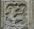 Panel 13:04 - Warlike monster with human torso on a basilisk's body (quite eroded)